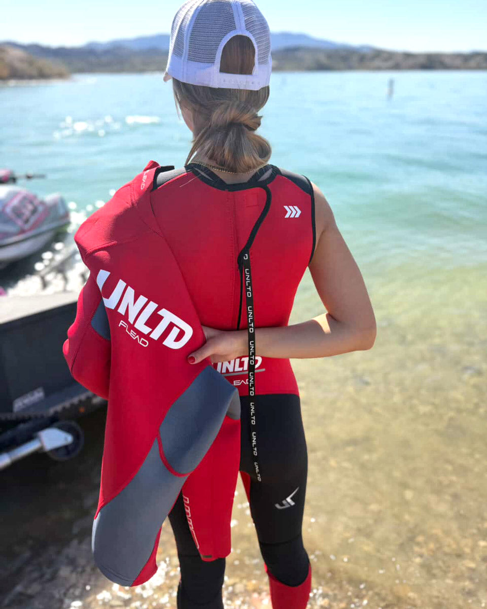 Unlimited PWC FLEAD Wet Jacket shown in red with adjustable straps and waterproof material for water sports.