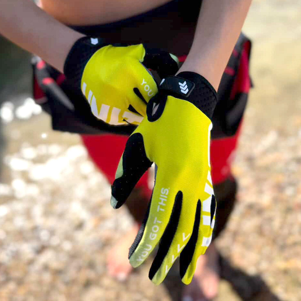 UNLIMITED PWC HYDRO X gloves showing yellow gloves with adjustable wrist straps and reinforced palm grip.
