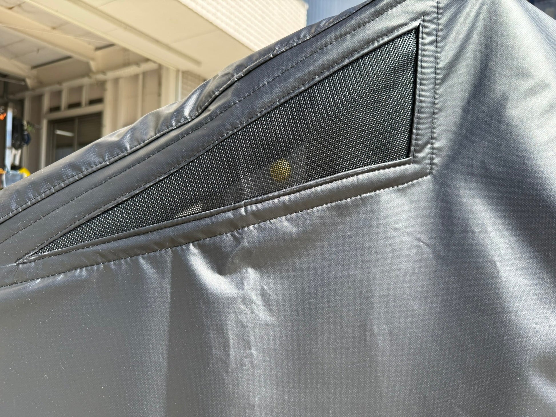 Universal PWC cover for GP1, GP1R, F1, and F16 hulls, made by UNLIMITED-PWC, shown fitting securely over a personal watercraft.