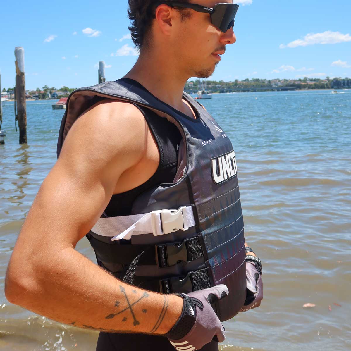 Unlimited PWC FLEAD S/E LIFE VEST shown with adjustable straps and bright orange color for safety and visibility.
