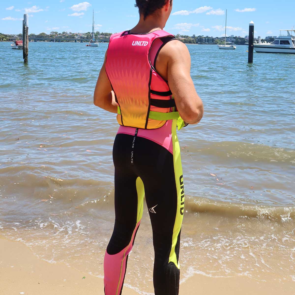 Unlimited PWC FLEAD S/E Life Vest shown in pink with adjustable straps and reflective details for safety during water activities.