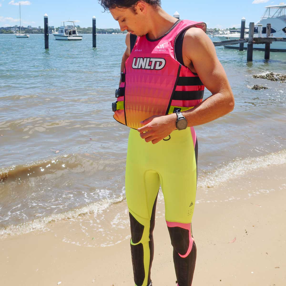Unlimited PWC FLEAD S/E Life Vest, bright pink personal flotation device with adjustable straps for safety and comfort.