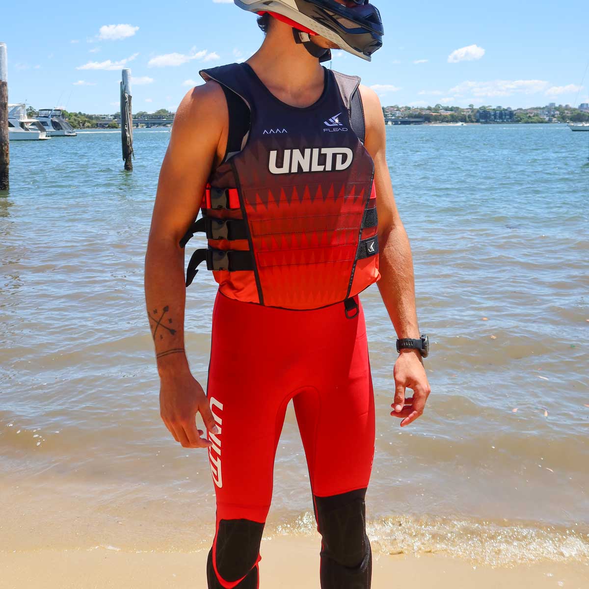Unlimited PWC FLEAD S/E Life Vest with adjustable straps and bright red color for safety and visibility on the water.